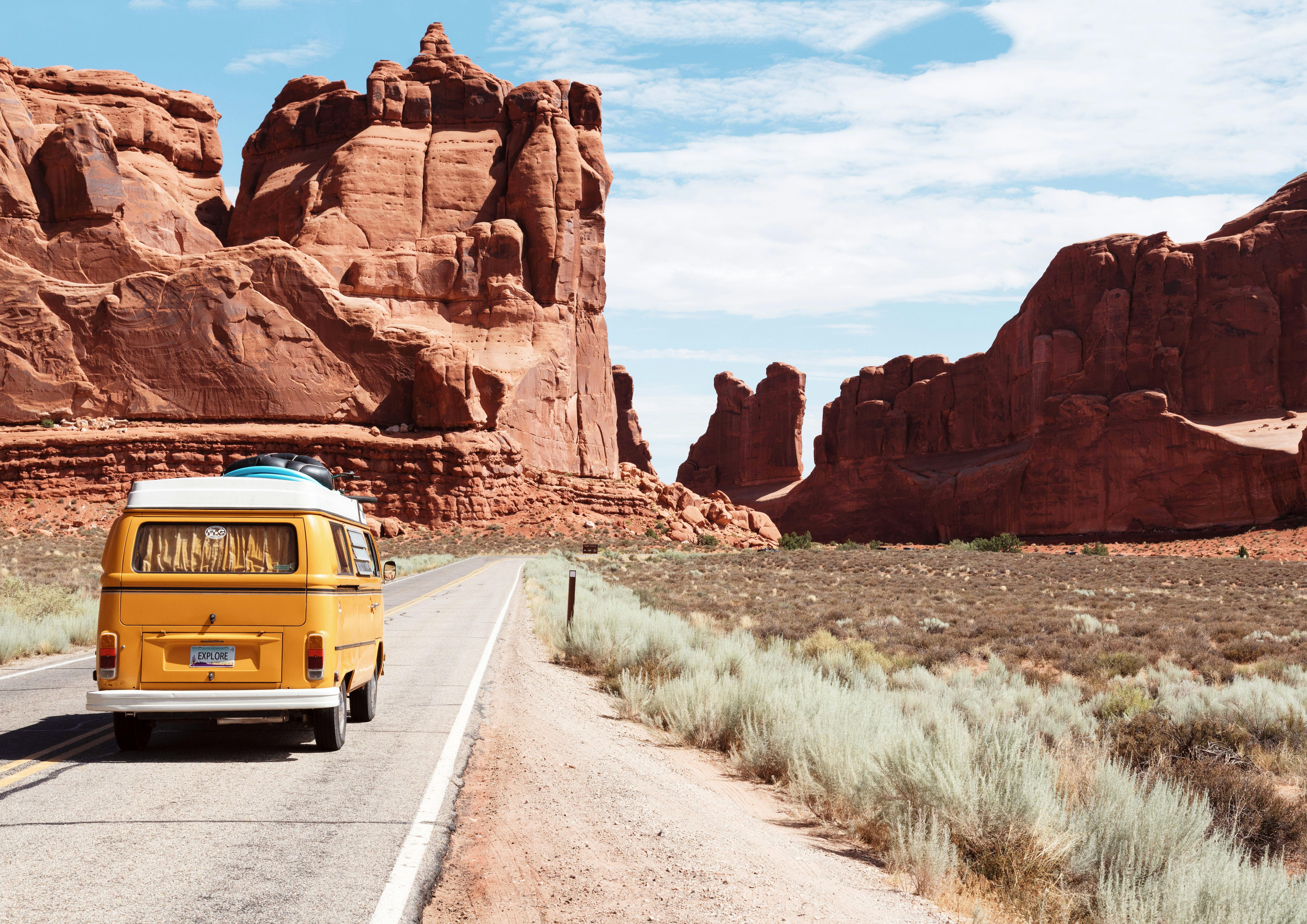yellow Volkswagen van on road by Dino Reichmuth courtesy of Unsplash.