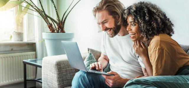 Couple Looking at the Laptop